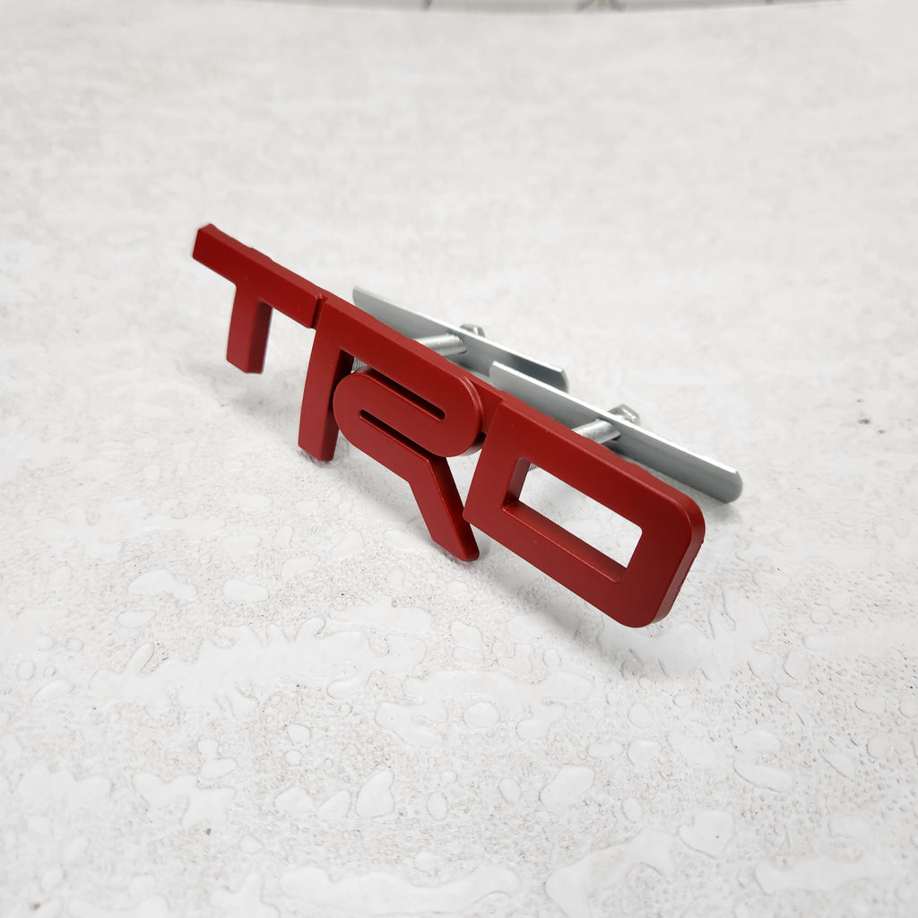TRD Red Grille Metal Emblem (12 x 3.5 cm)